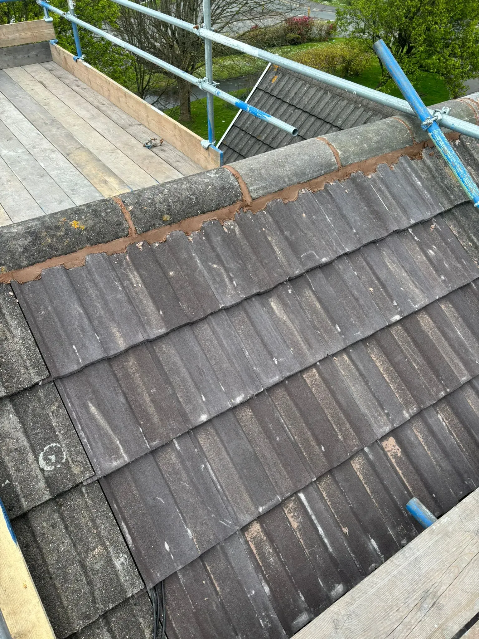 Fresh mortar pointing on roof ridge tiles
